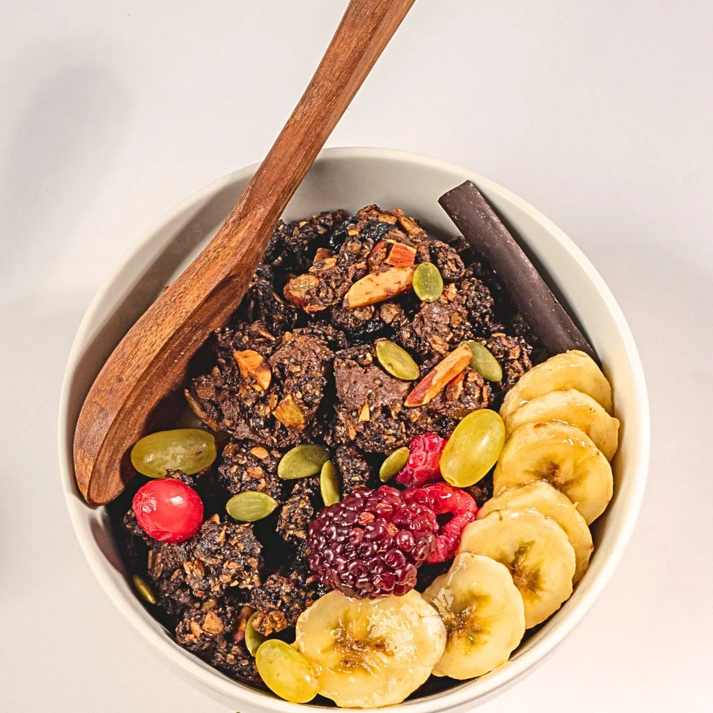 Bowl of Nibl Chocolate Fruit & Nut Granola with milk – healthy breakfast Pakistan